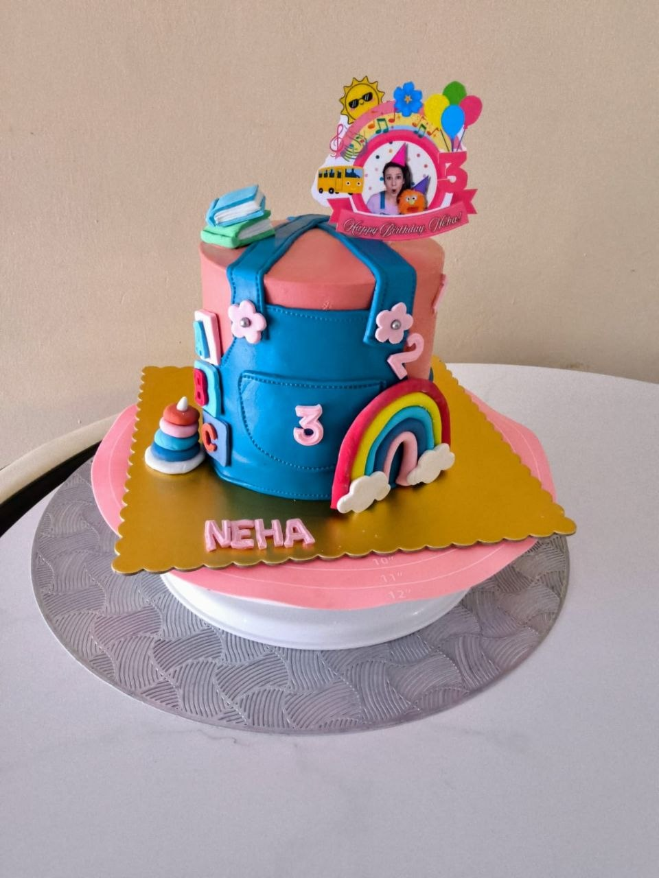 Colorful kids celebration cake with bright topper